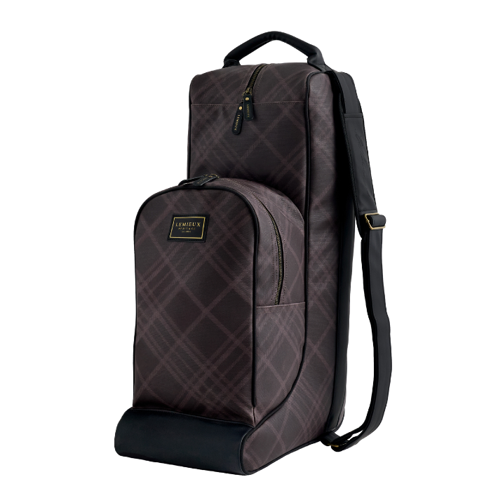 A dark brown and black plaid backpack shown from a three-quarter angle on a solid white background. The brand name 'LeMieux' is visible on a gold plaque on the front pocket.