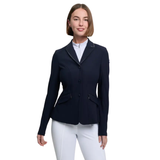 Woman wearing a navy blue riding jacket and white pants on a white background