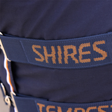 Navy blue equestrian bridle with 'Shires' branding on a close-up shot.