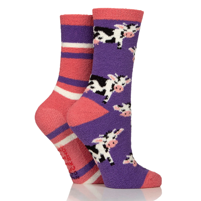 Two pairs of socks with cow patterns on a white background