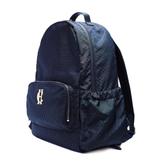 Holland Cooper Burghley Backpack Variant Ink Navy Monogram. A navy blue backpack with a subtle geometric pattern, featuring a front zippered pocket with a gold-tone 'HC' logo and a side mesh pocket, shown on a white background.
