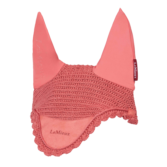 LeMieux AW26 Classic Fly Hood Variant Spiced Earth. A coral pink horse ear bonnet with a crocheted mesh body, lace trim, and pointed ear covers, featuring the LeMieux brand name.