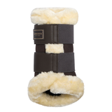 LeMieux AW26 Heritage Fleece Edged Brushing Boot Varient Cocoa. A dark brown leather horse boot with cream-colored fleece lining, featuring a brand label that reads 'LeMieux'.
