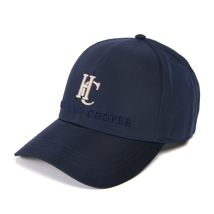 Navy cap with a Gold embroidered design on a white background
