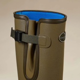 Le Chameau Ladies Vierzonord Neoprene Lined Wellies Variant Iconic Green. Close-up of a tall brown rubber boot with a blue interior lining and a black strap closure, shown against a plain beige background. 