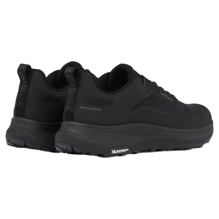 Lemieux Men's Kanta Waterproof Trainers Variant Black. Back of two Black trainers with the word 'waterproof' printed on a white background. 