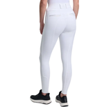 White riding pants worn by a person on a white background