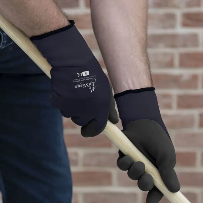 LeMieux AW26 Thermal Work Gloves Variant Colour Navy. A persons hand holding a broom handle wearing gloves in navy and black with 'LeMieux' brand name on white background. 