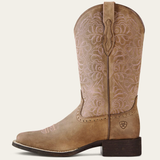 Ariat Ladie's Western Round Up Remuda Wide Toe Varient Brown Bomber. A single light brown leather cowboy boot with floral tooling on the shaft, a dark brown stacked heel, and a small shield logo on the side, shown against a plain off-white background.