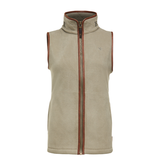 Holland Cooper Country Fleece Gilet Variant Sage. A sleeveless zip-up fleece vest in a light beige/tan color with brown trim along the collar, armholes, and zipper edges, shown against a plain white background.
