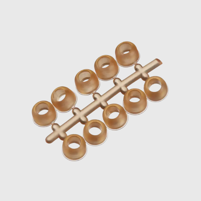 Orange stud plugs on a light gray background