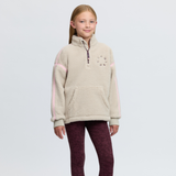 LeMieux AW26 Young Rider Jody Teddy Fleece Variant Colour Stone. A young person wearing a stone colour fleece top and burgundy colour leggings on white background. 