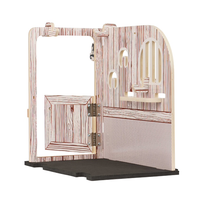 A miniature horse playset stall with a faux wood grain finish, featuring an open door, stable wall panels, a small wooden shelf, and a black rubber floor mat, shown on a white background.