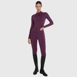 Person wearing a plum outfit on a white background