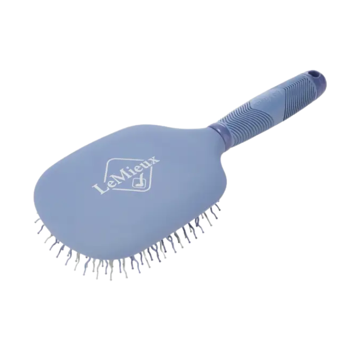 Blue pet grooming brush with LeMieux logo on a white background