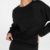 Black sweatshirt with geometric design on a plain background