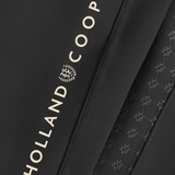 Holland Cooper Chiltern Contour Breeches Variant Colour Black.
Close up of brand name 'Holland Cooper' on black material.