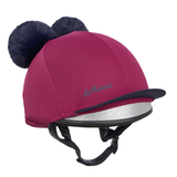 LeMieux AW26 Mini Double Pom Hat Silk Variant Colour Blackberry.
A magenta pink riding helmet with two dark navy blue faux fur pom-poms on top, a black visor, and a silver glitter trim on the brim. The brand name 'LeMieux' is embroidered in teal on the side.