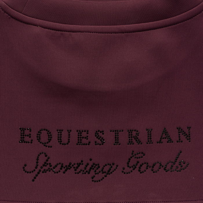 Holland Cooper Cranborne Crystal Crew Variant Mulberry. Close-up of a dark plum-colored garment with 'EQUESTRIAN Sporting Goods' embroidered in black rhinestone lettering across the chest.