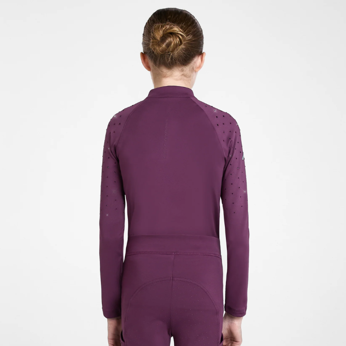 A child model shown from the back wearing a long-sleeve base layer in a deep plum purple color, featuring perforated details on the upper arms, against a plain white studio background.