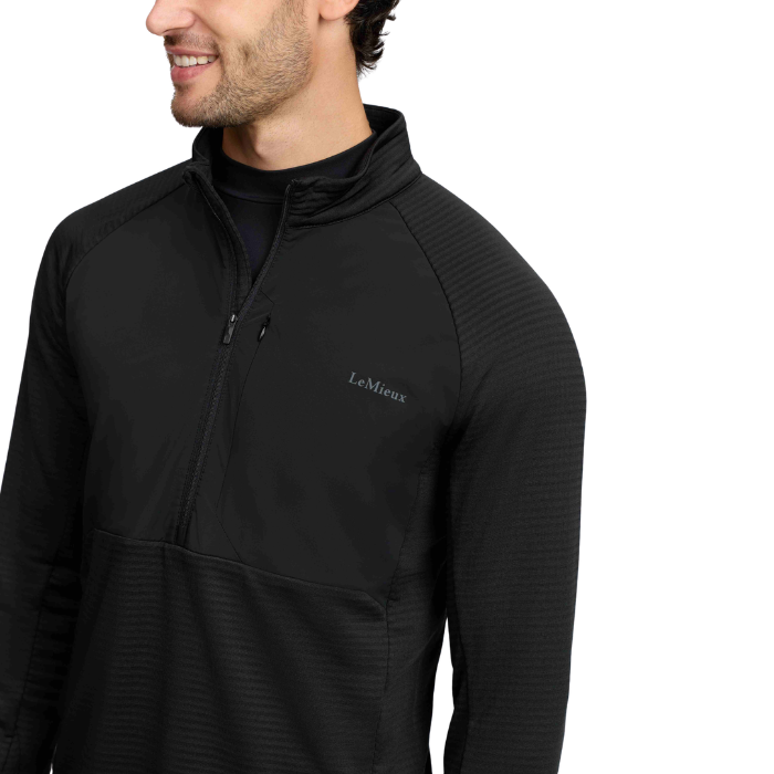 Close up of a man wearing a Black sweatshirt with LeMieux on the chest against a White background. 