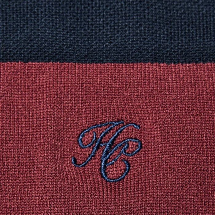 Holland Cooper Riding Sock Variant Oxblood Navy. A material patch in dark red and navy with HC embroided