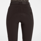 Back of brown equestrian breeches with a full grip seat against a grey background. 
