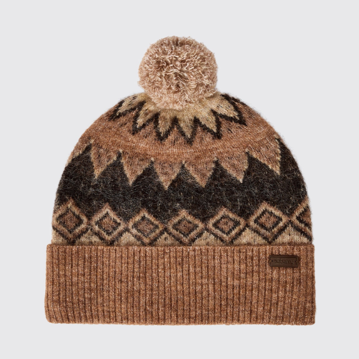 Dubarry Of Ireland Coolroe Bobble Hat Variant Oat Multi. A knit pom-pom beanie hat featuring a brown, tan, and black geometric pattern, with a ribbed knit cuff and a small dark brown brand tag on the side, set against a light gray background.