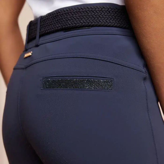 blue clothing with belt and pocket trim