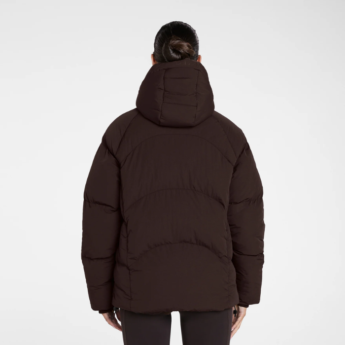 Aztec Diamond Matt Puffer AW26 Variant Espresso. A person viewed from the back wearing a dark brown puffer jacket with a hood, set against a plain light gray studio background.