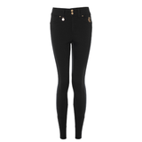 Holland Cooper Jodhpur Jean Variant Black. Black skinny jeans with gold-tone hardware, including button details on the waistband and a decorative emblem on the pocket, shown against a plain white background.