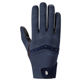 A single dark navy blue riding glove shown from the back, featuring a textured palm, a decorative band with blue rhinestones, and a brand logo on the wrist, set against a plain white background.