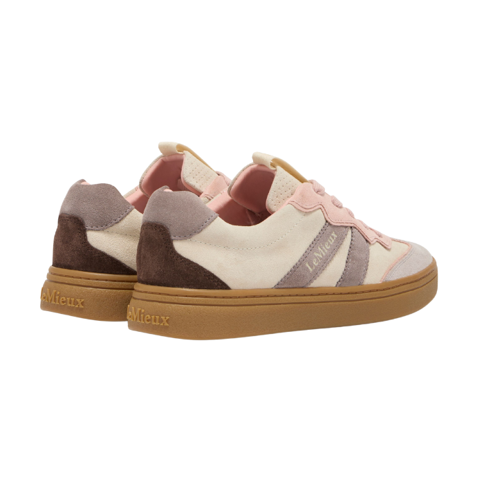 Pair of multicolored sneakers with a brand name on a white background