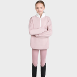 Person wearing a pink jumper with a white collar on a light gray background