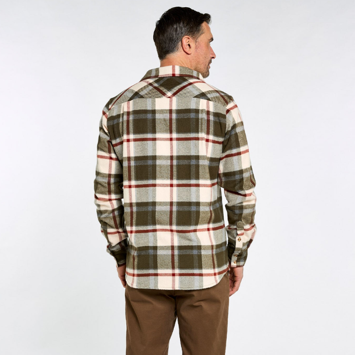 Dubarry Townley Men's Hunting Check Shirt Variant Dusky Green. A man viewed from the back wearing a long-sleeve plaid flannel shirt in olive green, cream, and red, paired with brown pants, against a plain white studio background.