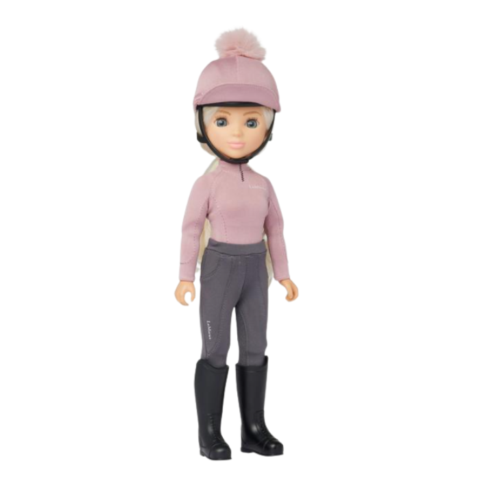 LeMieux AW26 Toy Rider Amelia Varient Multi. Blonde toy rider wearing a pink base layer with a matching hat silk and grey trousers on a white background. 