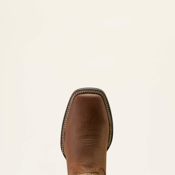 Ariat Men's Western Big Rig Wide Square Toe Cowboy Boot Variant Colour Distressed Brown. Close up of Western squared toe boot in brown on light cream background.