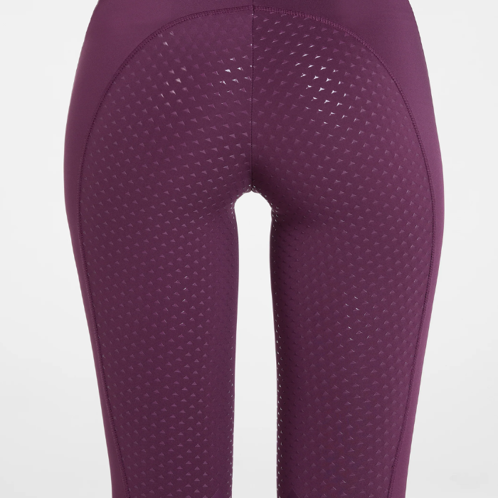 Aztec Diamond AW26 Core Leggings Full Seat Variant Plum. Close up of the back of a pair of plum breaches with a full grip seat against a white background. 