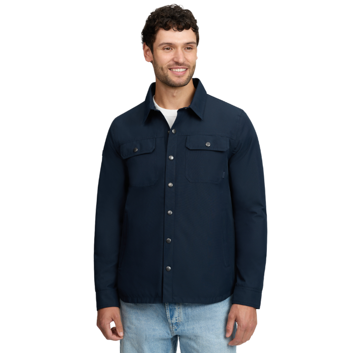 LeMieux AW26 Mens Showerproof Shacket Varient Navy. A man wearing a dark navy blue button-up shirt jacket with two chest flap pockets, shown against a plain white background.