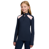 LeMieux AW26 Young Rider Mia Mesh Base Layer Varient Navy. A young girl modeling a navy blue long-sleeve athletic quarter-zip top with light pink shoulder panels and white vertical branding on the sleeve, set against a plain white background.