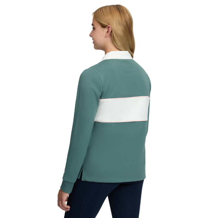 LeMieux AW26 Young Rider Riley Rugby Shirt Varient Aloe. A woman shown from the back wearing a long-sleeve colorblock rugby-style top in teal green with a wide white horizontal band across the upper back and a white collar, paired with dark navy leggings, on a plain white background.