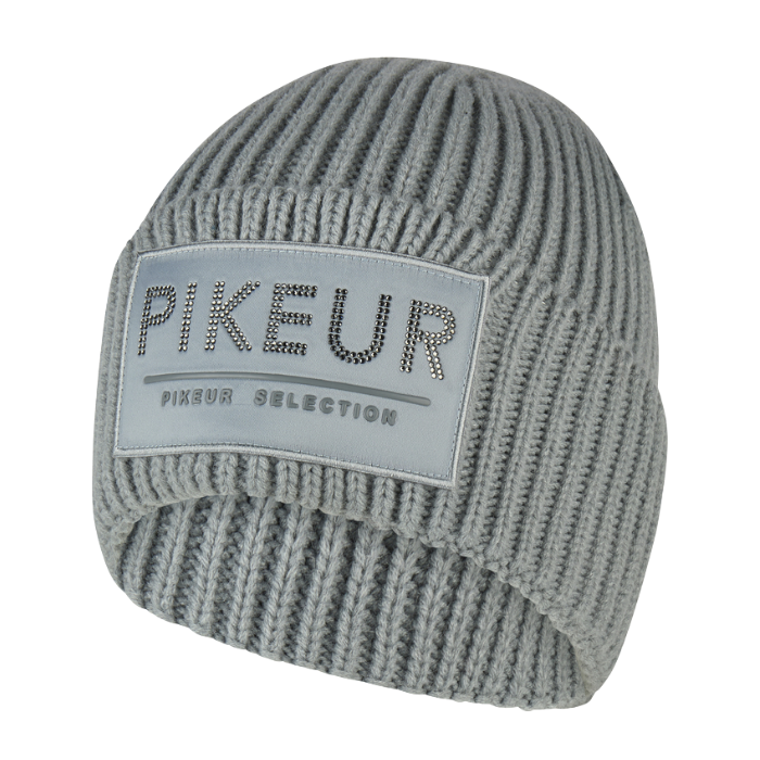Pikeur Beanie Selection 285800 Variant Dusty Blue. A light gray/blue ribbed knit beanie hat featuring a rectangular light gray patch on the front with the brand name 'PIKEUR' and 'PIXEUR SELECTION' in gray lettering.