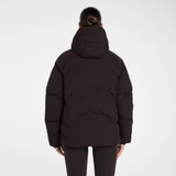 Back of person wearing a expresso puffer jacket on a white background