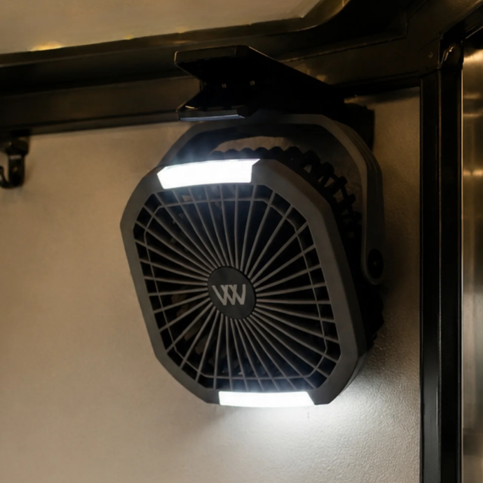 A black octagonal outdoor light fixture with integrated LED strips at the top and bottom, mounted on a beige wall under a dark metal frame. The center features a circular black grille with a white stylized 'W' logo.