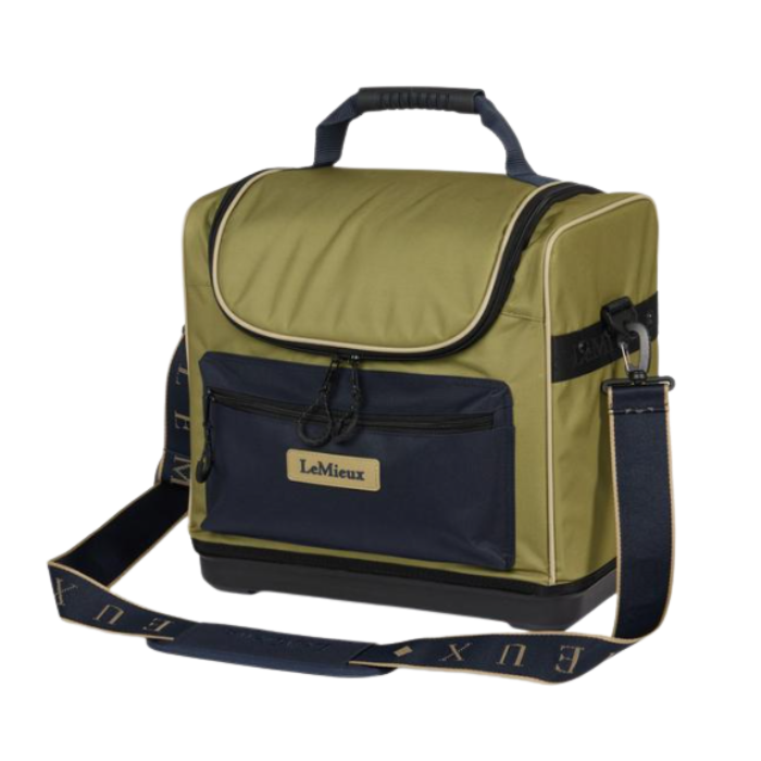 LeMieux AW26 Elite Pro Grooming Bag Varient Gooseberry. An olive green and navy blue bag with a top handle, front zippered pocket, and a detachable navy blue shoulder strap with gold lettering, shown on a plain white background.