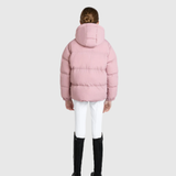 Back of person wearing a pink puffer jacket on a light grey background