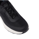toe of navy trainer with 'LeMieux' brand and laces on white background
