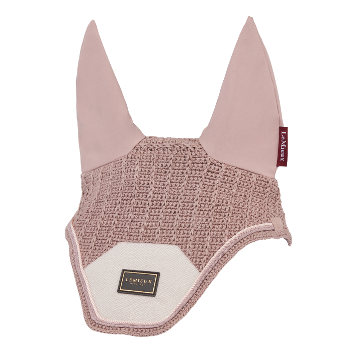 LeMieux AW26 Heritage Fly Hood Variant Wild Rose. A dusty pink horse fly veil with a textured knit body, solid pink ears, and a cream-colored front flap with a small black and gold Les Mieux brand patch.