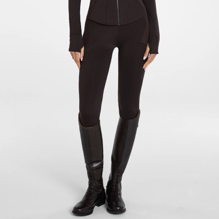 Aztec Diamond AW26 Core Leggings Full Seat Variant Espresso. Brown equestrian riding breeches with textured knee panels, shown on a model wearing matching black riding boots against a light gray studio background.