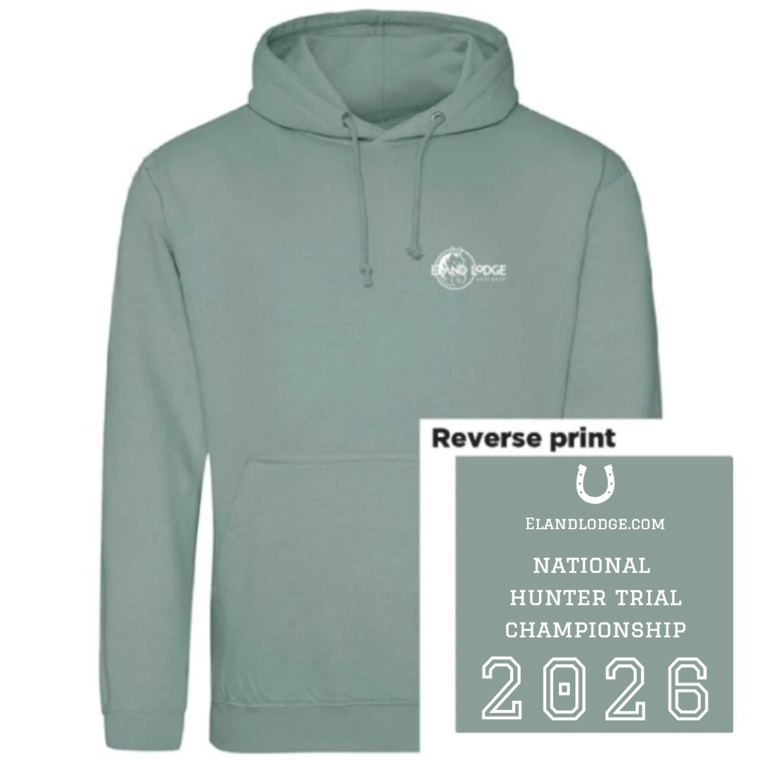 A sage green pullover hoodie with a white printed logo on the left chest, shown on a white background with a graphic overlay explaining the 'Reverse print' design for the National Hunter Trial Championship 2026.